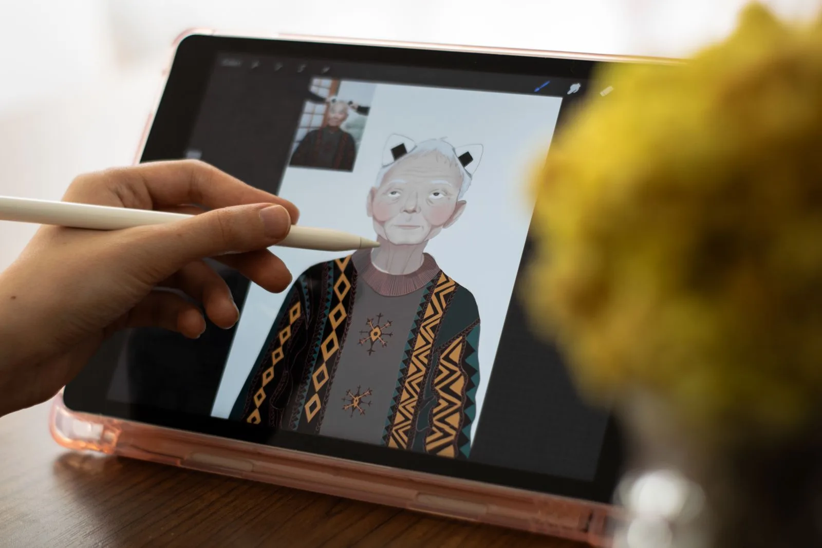Hands holding a tablet with a touchscreen