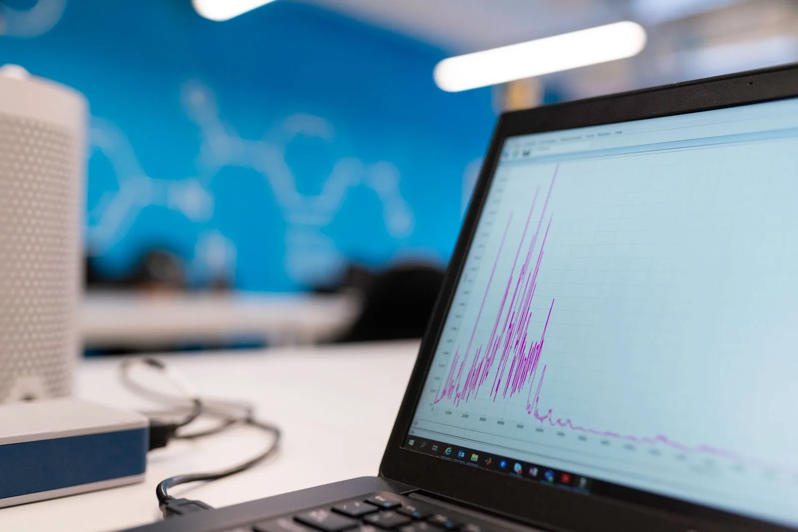 A laptop displaying a data analytics graph