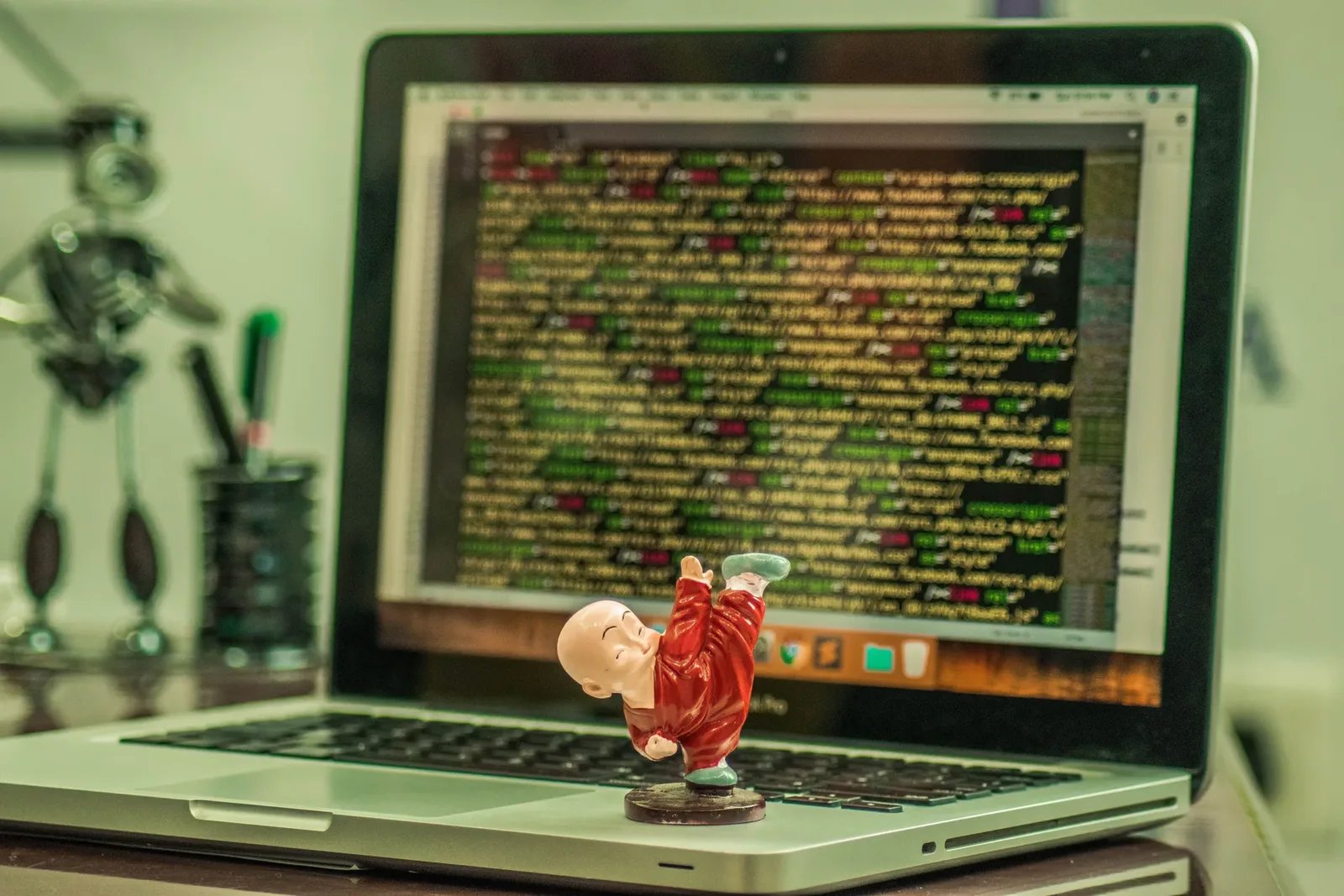 A young child using a laptop, exploring simple, icon-based interactions